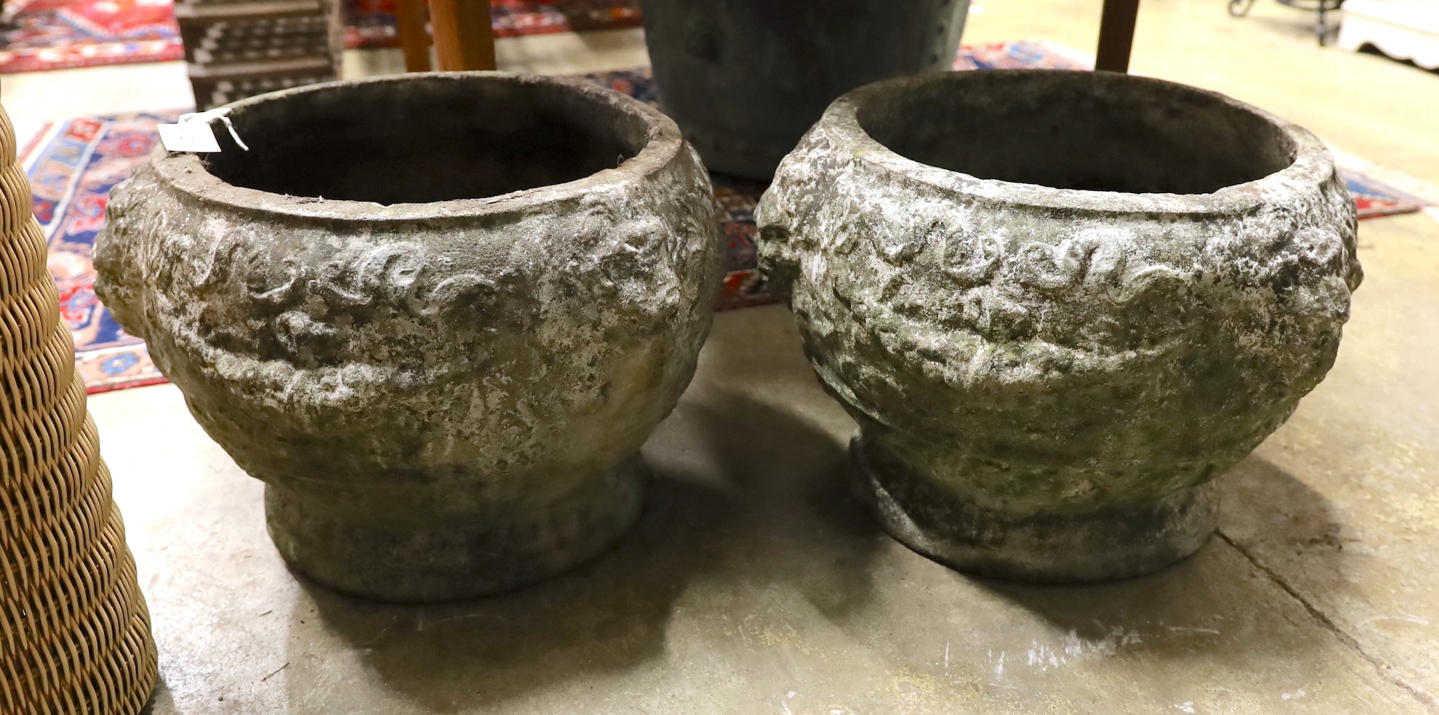 A pair of reconstituted stone garden planters, diameter 46cm, height 32cm